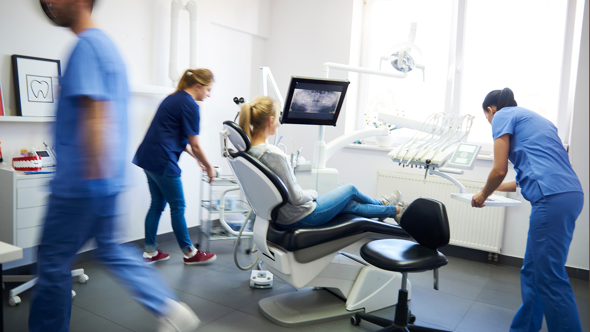 A collage of four photos depicting a hospital setting with medical professionals in action, including a dentist s office and a dental chair, alongside a nurse attending to patients.